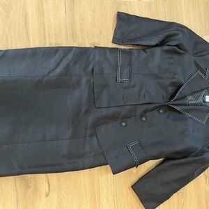 Black crop jacket with matching dress with poki dot sat tan lining.